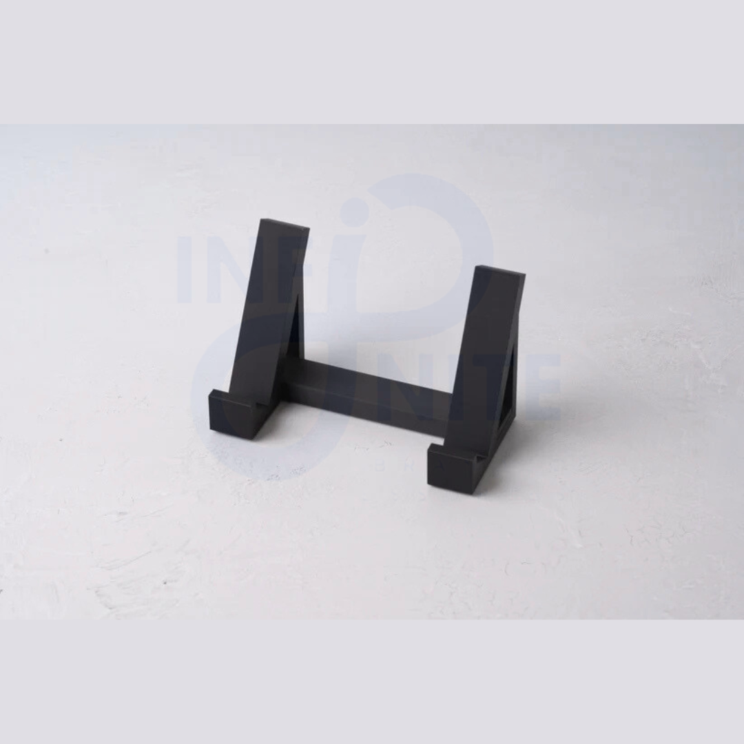 Plastic space-saving keyboard stand pair displayed on a plain surface without a keyboard
