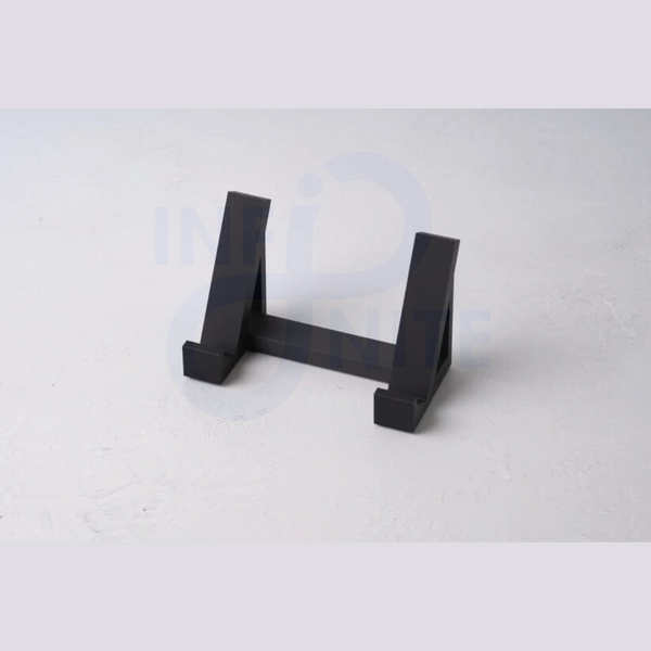 Plastic space-saving keyboard stand pair displayed on a plain surface without a keyboard